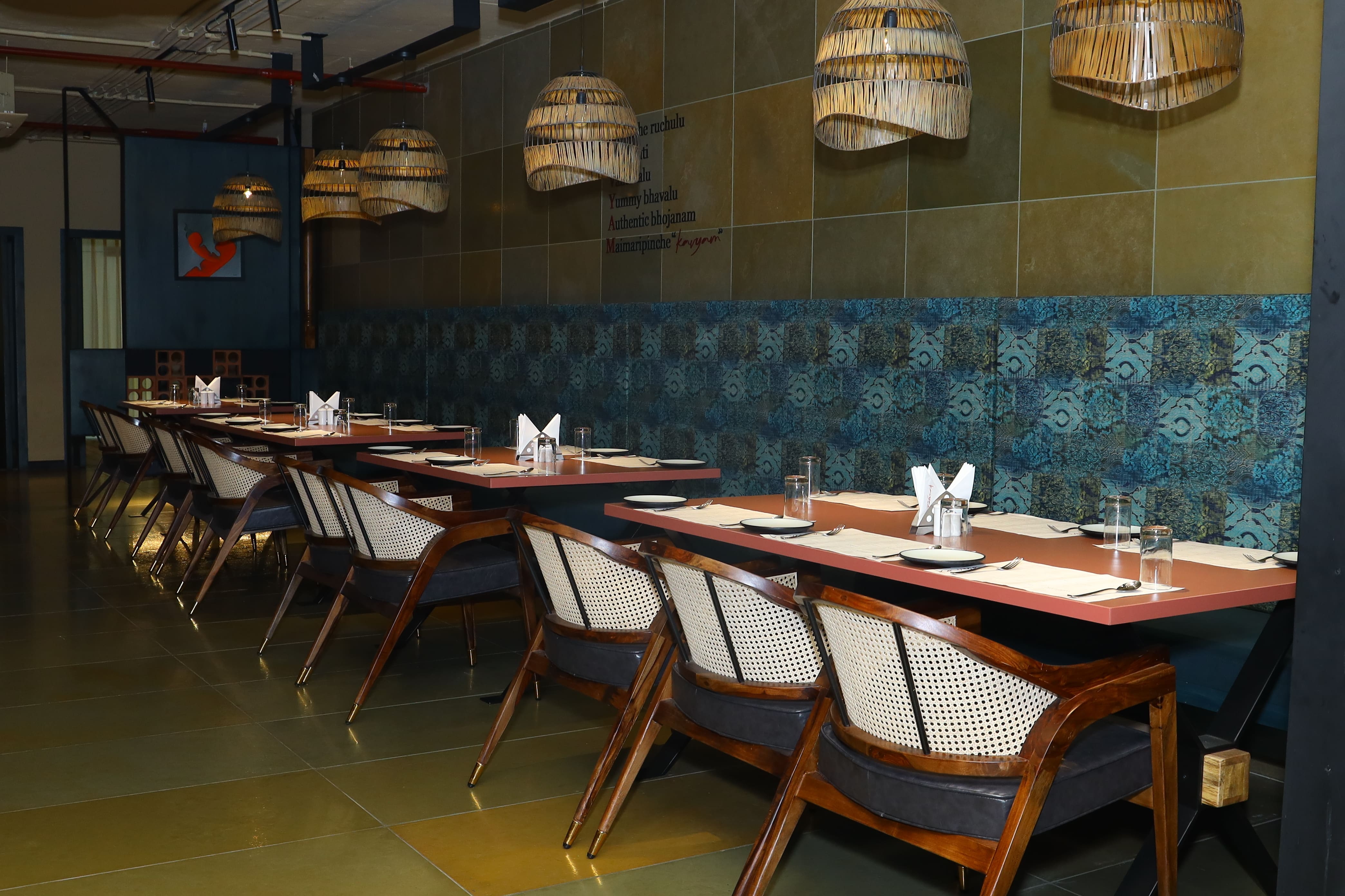 Evening at Kavyam — warm lamps in the tree-lined dining room